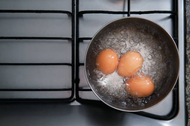 istock eggs in boiling water on stove 1013684926