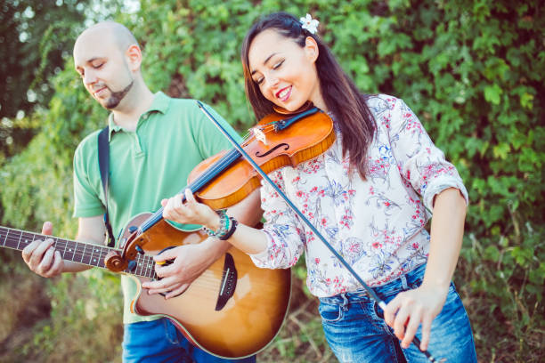 istock Musicians with guitar and violin 1013694656