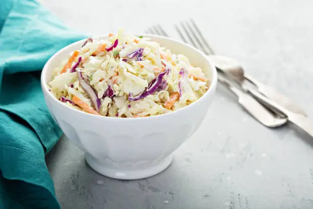 Traditional cole slaw salad in a white bowl