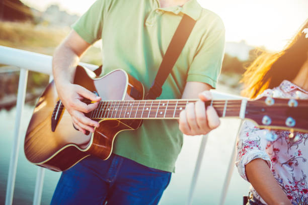 istock Male musician with his guitar 1013698372
