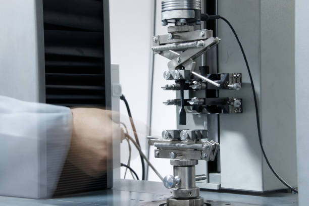 Rubber factory lab. test equipment elongation test making lab.. elongation at break gasket stock pictures, royalty-free photos & images