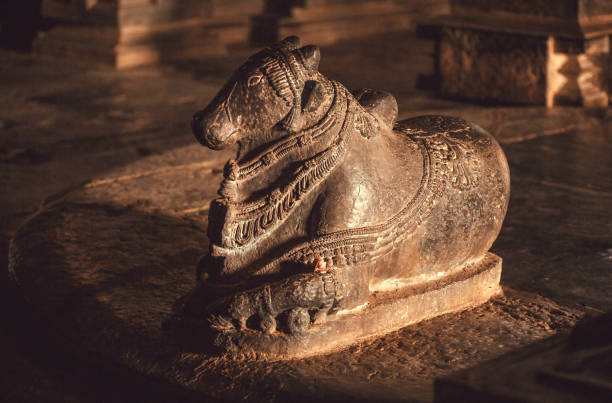 Hindu diety bull Nandi inside old stone temple in India