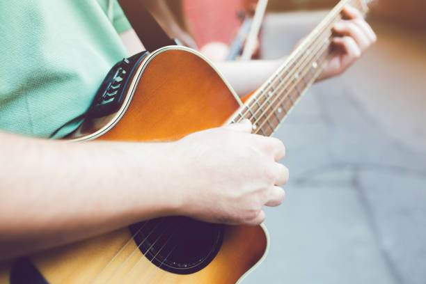 istock Male musician with his guitar 1013707690