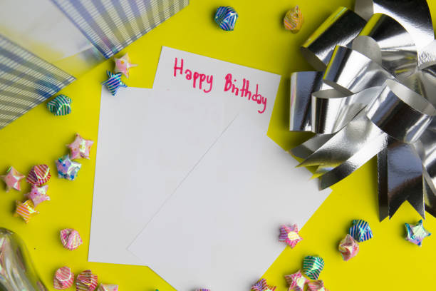 istock ribbon on gift box on yellow background. 1013708168