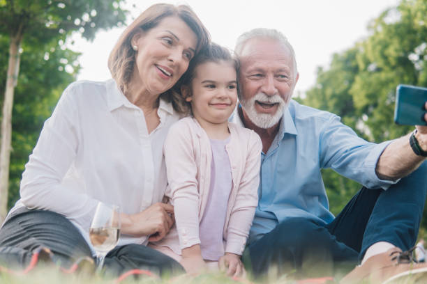 istock Grandparents taking a selfie with granddaughter 1013715680