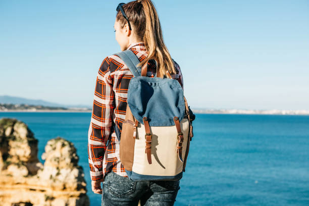 istock A tourist girl or a traveler with a backpack 1013715842