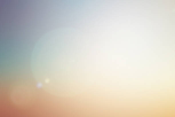 istock blurred beautiful natural pastel background lens ray flare flash light. 1013718126