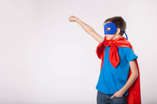 istock Little superman boy raised his hand up 1013719468