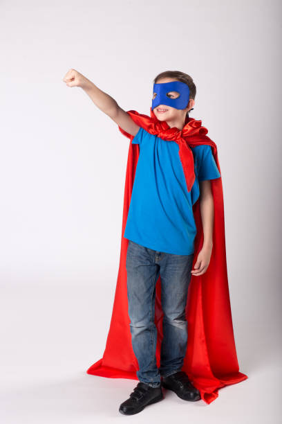 istock Superman child raised his hand up, pretend flying 1013719496