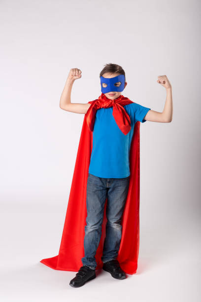 istock Funny superhero child shows his muscle 1013719514