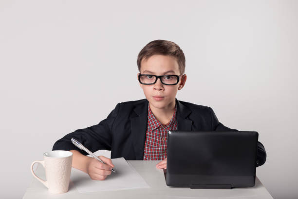 istock Young business boy sittin at the table 1013721718