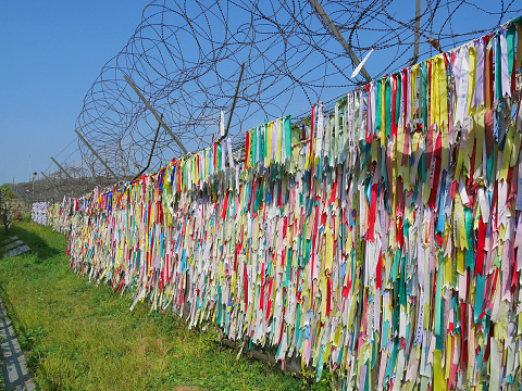 PAJU, SOUTH KOREA - SEPTEMBER 26, 2017: Colorful prayer ribbons at Imjingak Park near DMZ or demilitarized zone. South Koreans tie these ribbons with messages for their family members in the North.