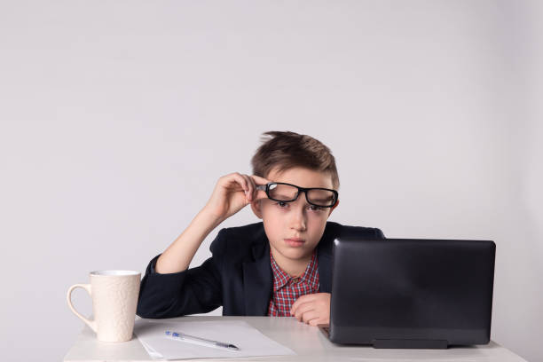 istock Young tired business boy in suit and eyeglasses 1013721830