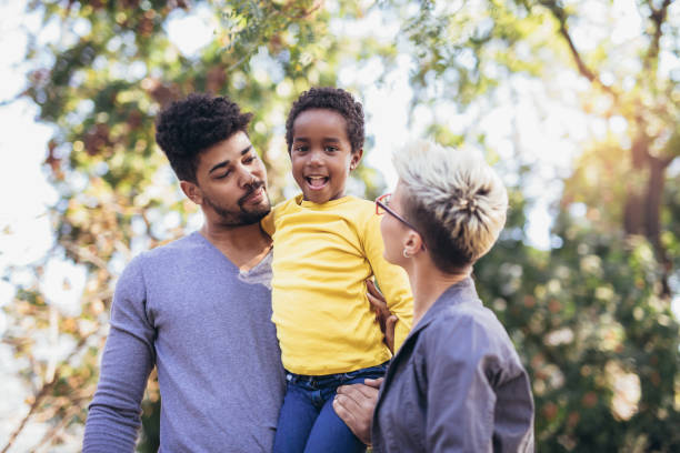 istock Happy young mixed race couple spending time with their daughter 1013722546