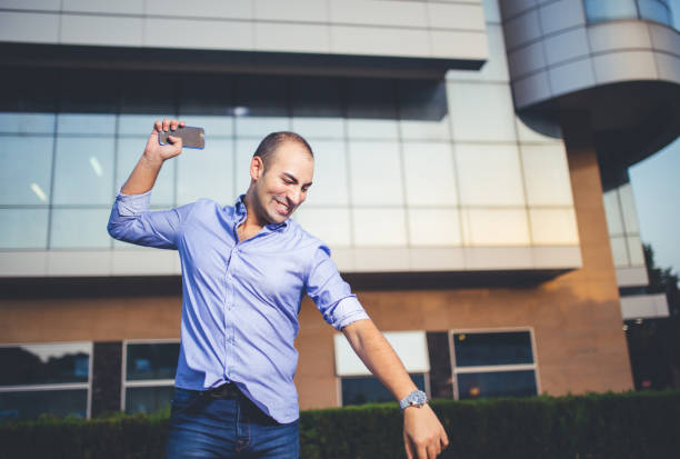 Angry man hrowing his phone