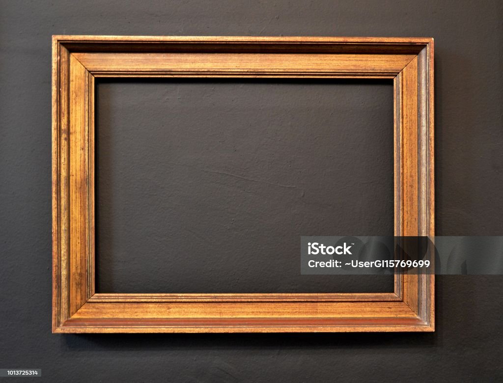 Empty frame Empty picture frame on black wall Picture Frame Stock Photo