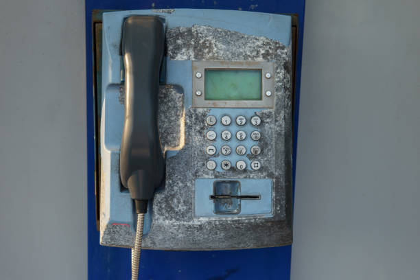 istock Old street rusty phone. Non-working shabby apparatus 1013726164