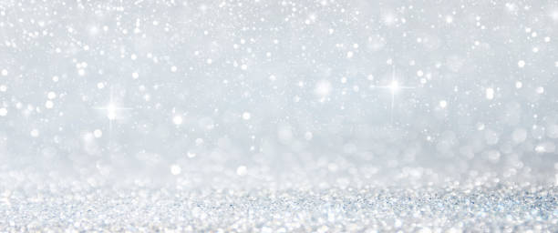 istock Christmas light background.  Holiday glowing backdrop. Defocused Background With Blinking Stars. Blurred Bokeh. 1013730536