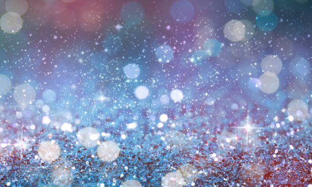 istock Christmas light background.  Holiday glowing backdrop. Defocused Background With Blinking Stars. Blurred Bokeh. 1013730988