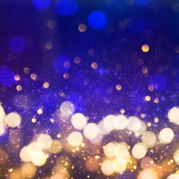 istock Christmas light background.  Holiday glowing backdrop. Defocused Background With Blinking Stars. Blurred Bokeh. 1013731004