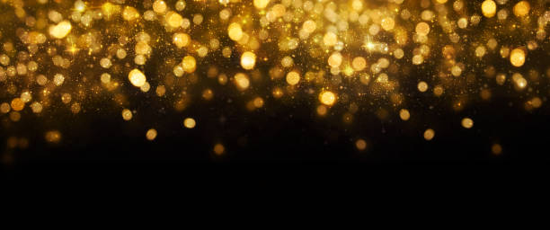 istock Christmas Gold light background.  Holiday glowing backdrop. Defocused Background With Blinking Stars. Blurred Bokeh. 1013731298