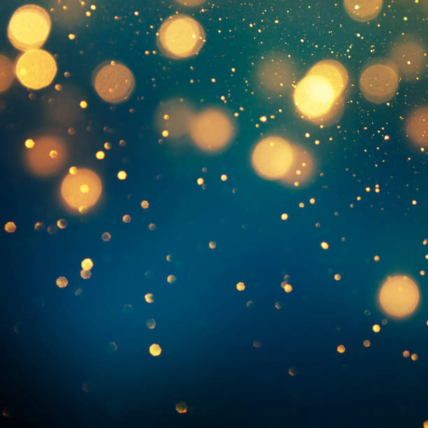 istock Christmas light background.  Holiday glowing backdrop. Defocused Background With Blinking Stars. Blurred Bokeh. 1013731546