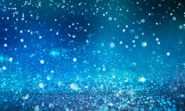 istock Christmas light background.  Holiday glowing backdrop. Defocused Background With Blinking Stars. Blurred Bokeh. 1013731622