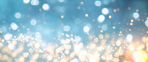 istock Christmas light background.  Holiday glowing backdrop. Defocused Background With Blinking Stars. Blurred Bokeh. 1013731652