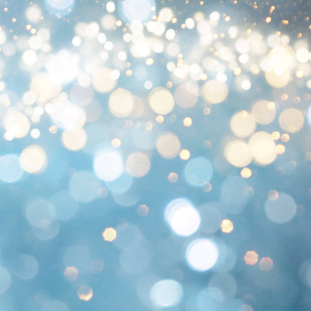 istock Christmas light background.  Holiday glowing backdrop. Defocused Background With Blinking Stars. Blurred Bokeh. 1013731684