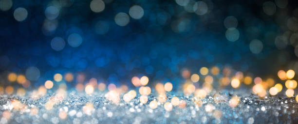 istock Christmas light background.  Holiday glowing backdrop. Defocused Background With Blinking Stars. Blurred Bokeh. 1013734374
