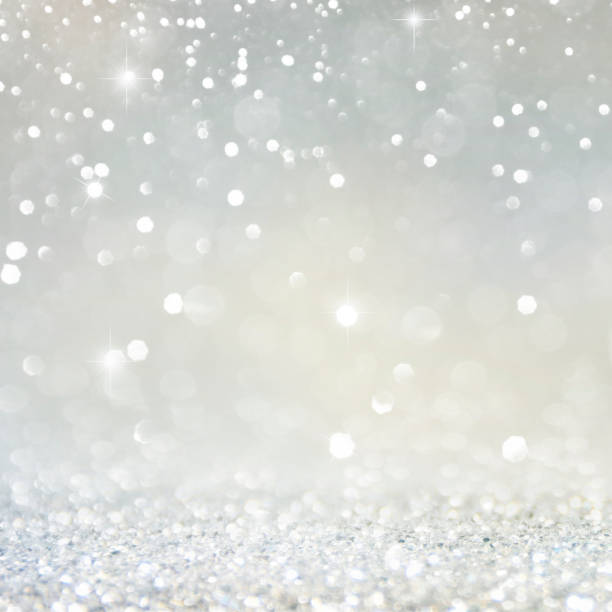 istock Christmas light background.  Holiday glowing backdrop. Defocused Background With Blinking Stars. Blurred Bokeh. 1013734694