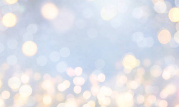 istock Christmas light background.  Holiday glowing backdrop. Defocused Background With Blinking Stars. Blurred Bokeh. 1013734810