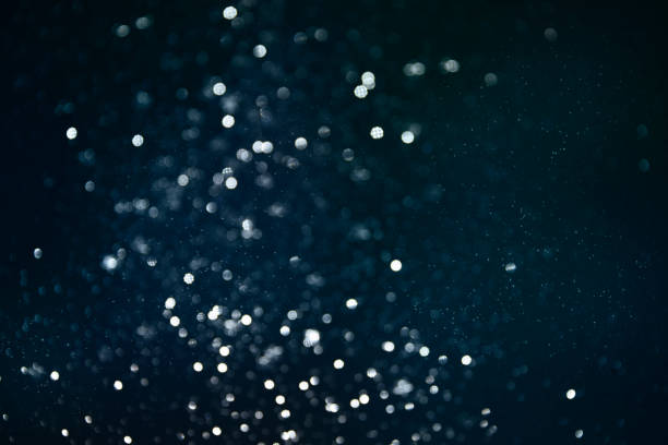 istock Bokeh light background.  Holiday glowing backdrop. Defocused Background With Blinking Stars. Blurred Bokeh. 1013737170