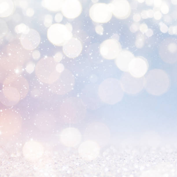 istock Christmas light background.  Holiday glowing backdrop. Defocused Background With Blinking Stars. Blurred Bokeh. 1013739704