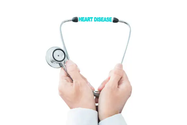 Closeup of anonymous male doctor hands holding a stethoscope with heart disease text, isolated on white background