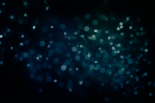 istock Bokeh light background.  Holiday glowing backdrop. Defocused Background With Blinking Stars. Blurred Bokeh. 1013743696