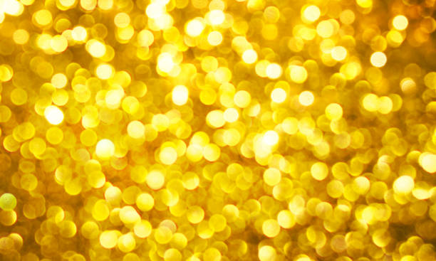 istock Christmas light background.  Holiday glowing backdrop. Defocused Background With Blinking Stars. Blurred Bokeh. 1013744204