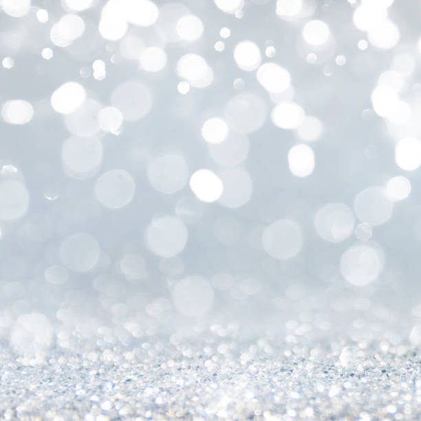 istock Christmas light background.  Holiday glowing backdrop. Defocused Background With Blinking Stars. Blurred Bokeh. 1013744500