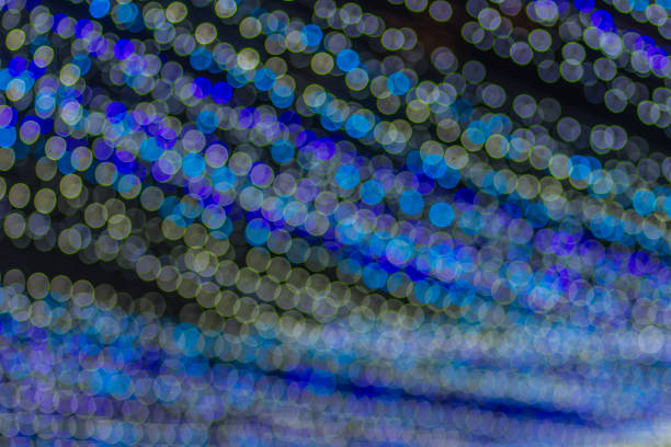 istock Abstract blurred blue Christmas tree lighting decoration with bokeh background. Defocused of decorated and illuminated blue christmas tree for Merry Christmas and new year festival celebration. 1013744666