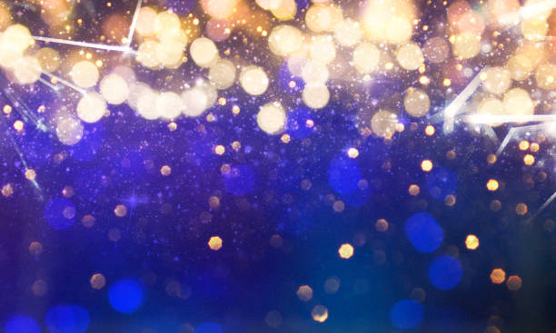istock Christmas light background.  Holiday glowing backdrop. Defocused Background With Blinking Stars. Blurred Bokeh. 1013751446