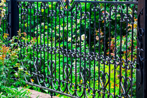 istock wrought-iron gates, ornamental forging, forged elements close-up 1013752144