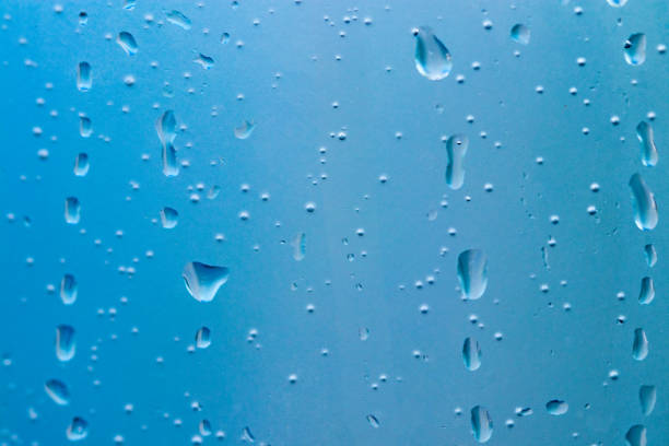 istock beautiful natural water drop on glass close up 1013752306