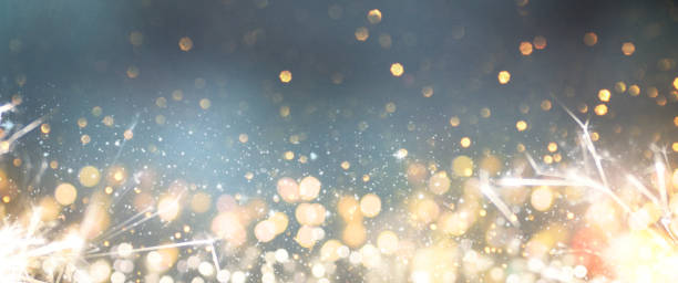istock Christmas light background.  Holiday glowing backdrop. Defocused Background With Blinking Stars. Blurred Bokeh. 1013756582