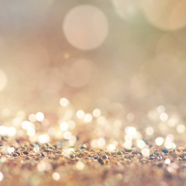istock Christmas light background.  Holiday glowing backdrop. Defocused Background With Blinking Stars. Blurred Bokeh. 1013756748