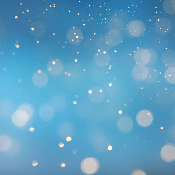istock Christmas light background.  Holiday glowing backdrop. Defocused Background With Blinking Stars. Blurred Bokeh. 1013758298