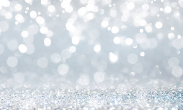 istock Christmas light background.  Holiday glowing backdrop. Defocused Background With Blinking Stars. Blurred Bokeh. 1013759242