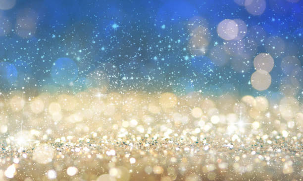 istock Christmas light background.  Holiday glowing backdrop. Defocused Background With Blinking Stars. Blurred Bokeh. 1013765496