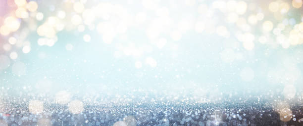 istock Christmas light background.  Holiday glowing backdrop. Defocused Background With Blinking Stars. Blurred Bokeh. 1013766342