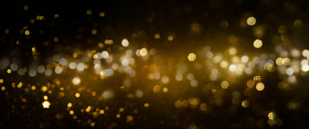 istock Christmas Gold light background.  Holiday glowing backdrop. Defocused Background With Blinking Stars. Blurred Bokeh. 1013766582