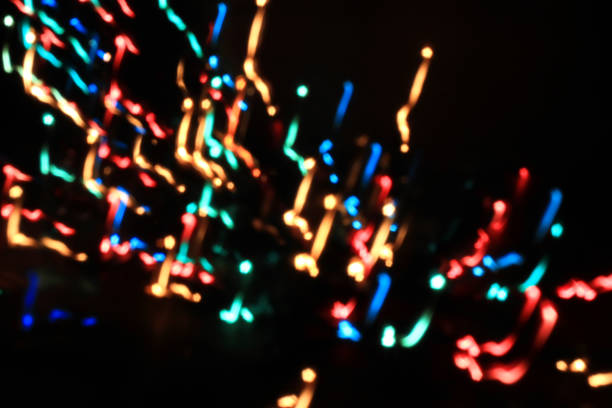 istock Various different multicoloured bubles close up in dark light background, festival and celebreties photo, nice bubbles,Christmas mood, New Year, celebrities mood, colorful light, light art 1013768582